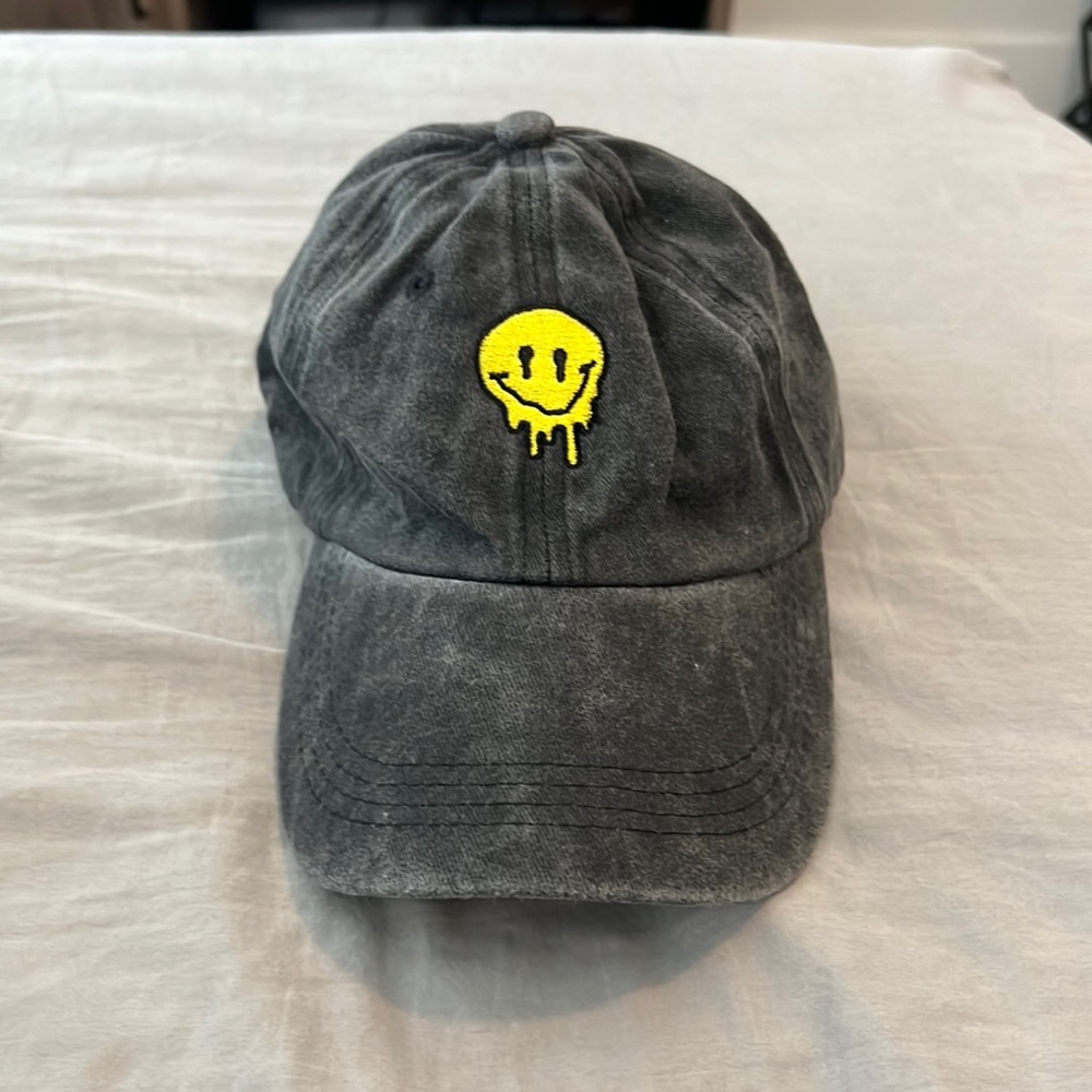Black smiley face strapback